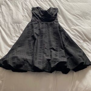 Strapless little black dress. 100% polyester.